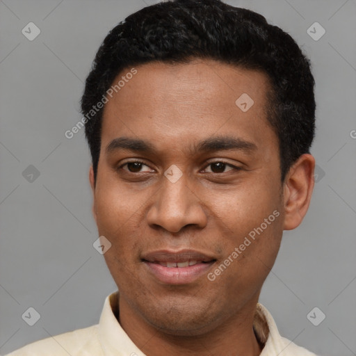 Joyful latino young-adult male with short  black hair and brown eyes