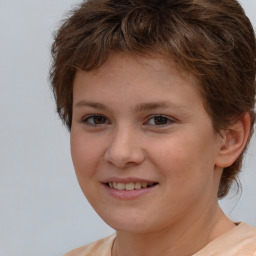 Joyful white child female with medium  brown hair and brown eyes