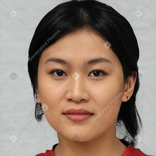 Joyful asian young-adult female with medium  black hair and brown eyes