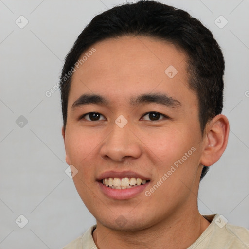 Joyful white young-adult male with short  black hair and brown eyes