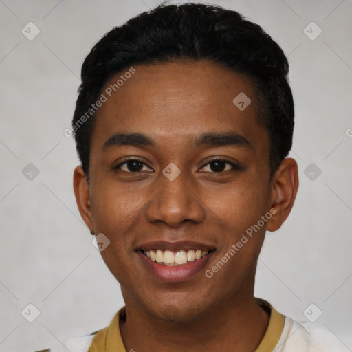 Joyful black young-adult male with short  black hair and brown eyes