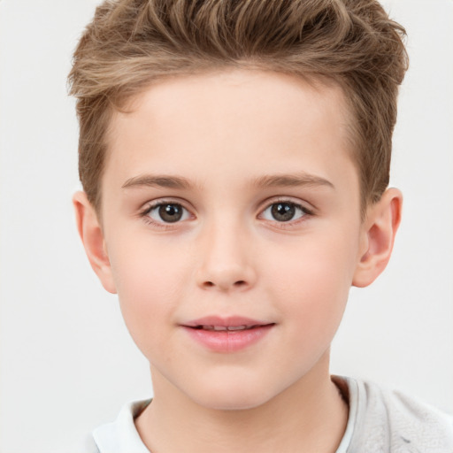 Joyful white child female with short  brown hair and brown eyes