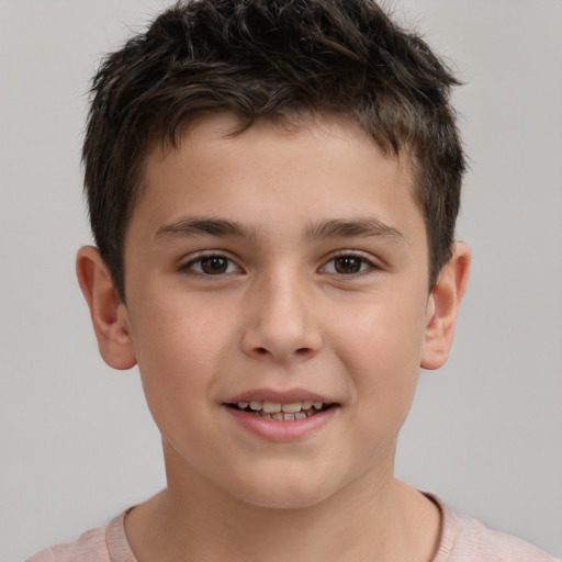 Joyful white child male with short  brown hair and brown eyes