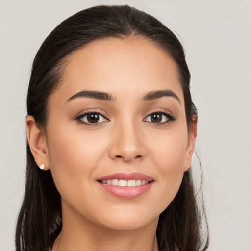 Joyful white young-adult female with long  brown hair and brown eyes