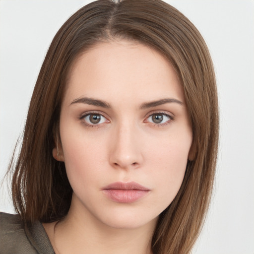 Neutral white young-adult female with long  brown hair and brown eyes