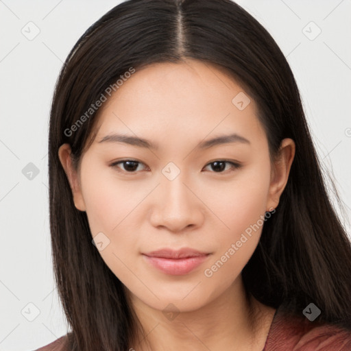 Joyful asian young-adult female with long  brown hair and brown eyes