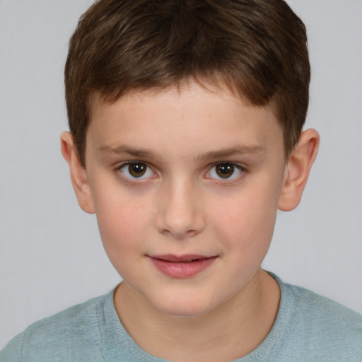 Joyful white child male with short  brown hair and brown eyes