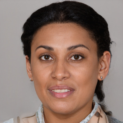 Joyful latino young-adult female with short  brown hair and brown eyes
