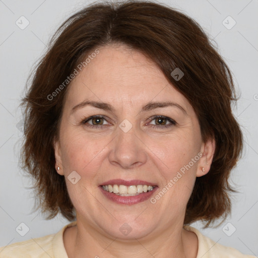 Joyful white adult female with medium  brown hair and brown eyes