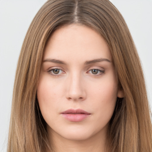 Neutral white young-adult female with long  brown hair and brown eyes