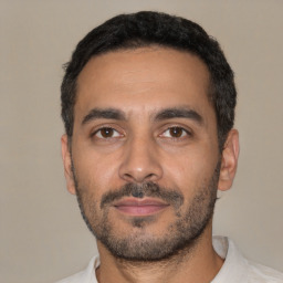 Neutral latino young-adult male with short  black hair and brown eyes
