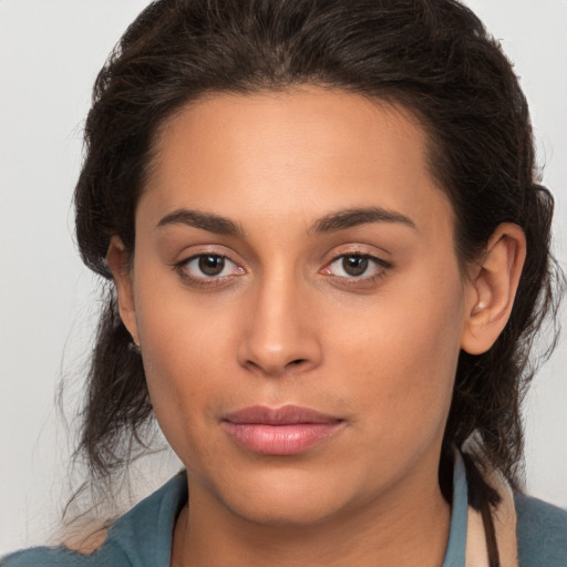 Joyful white young-adult female with long  brown hair and brown eyes