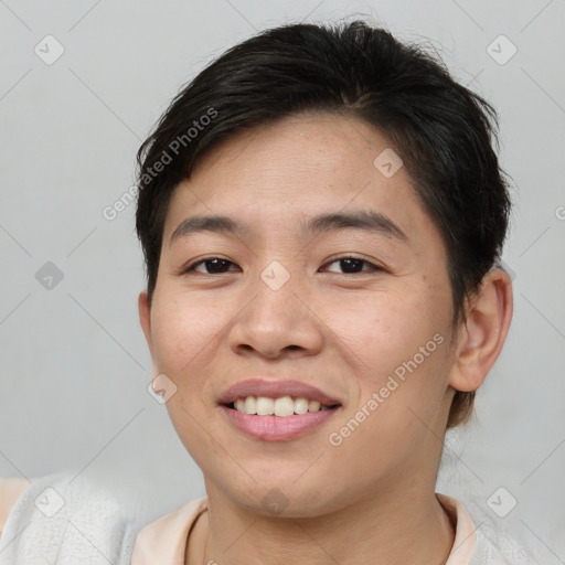 Joyful asian young-adult female with short  brown hair and brown eyes