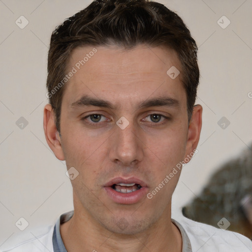 Neutral white young-adult male with short  brown hair and brown eyes