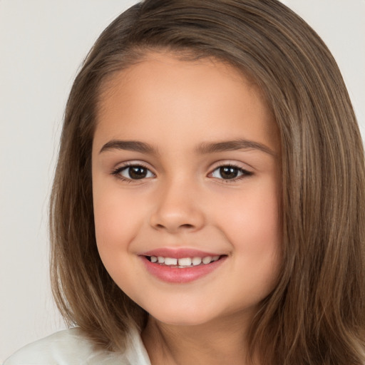 Joyful white child female with medium  brown hair and brown eyes