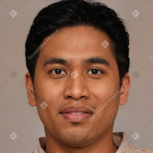 Joyful asian young-adult male with short  black hair and brown eyes