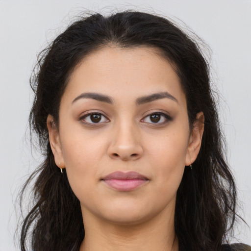Neutral latino young-adult female with long  brown hair and brown eyes