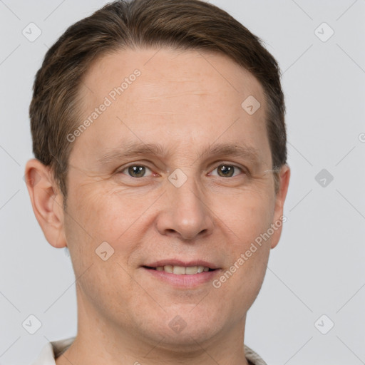 Joyful white adult male with short  brown hair and grey eyes