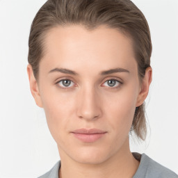 Neutral white young-adult female with medium  brown hair and grey eyes