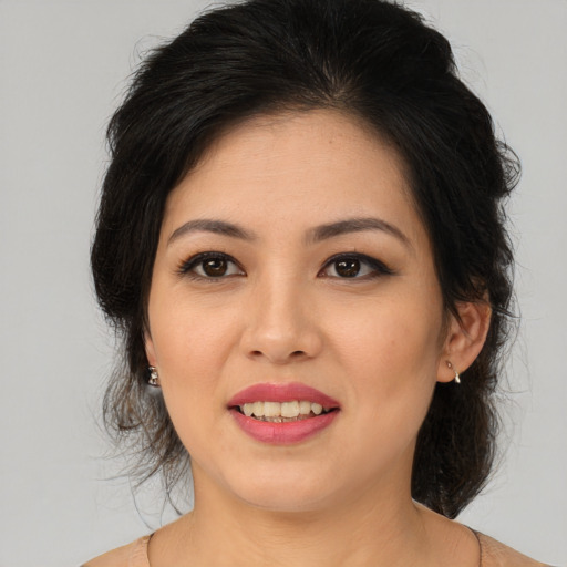 Joyful asian young-adult female with medium  brown hair and brown eyes