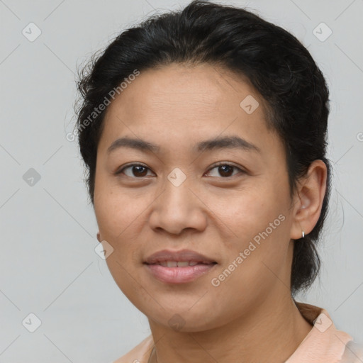 Joyful latino young-adult female with short  brown hair and brown eyes