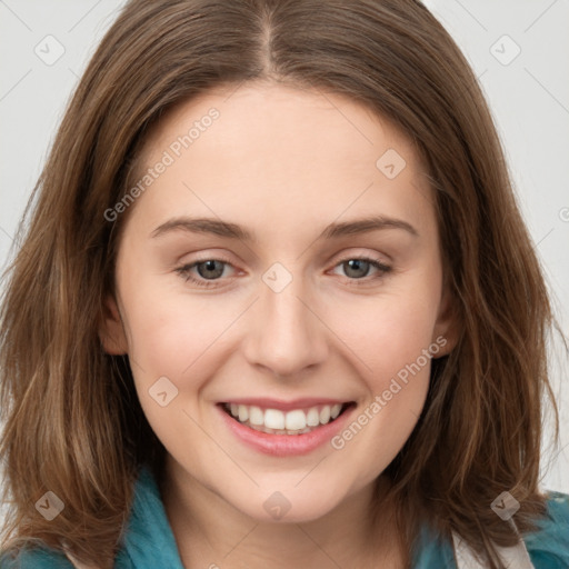 Joyful white young-adult female with long  brown hair and green eyes