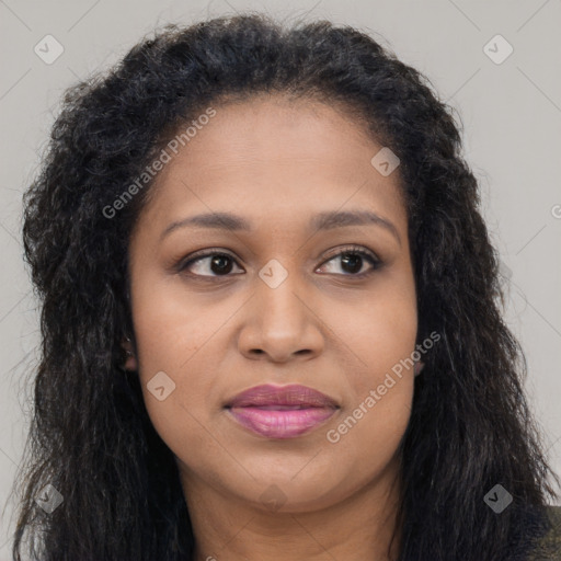 Joyful black young-adult female with long  brown hair and brown eyes