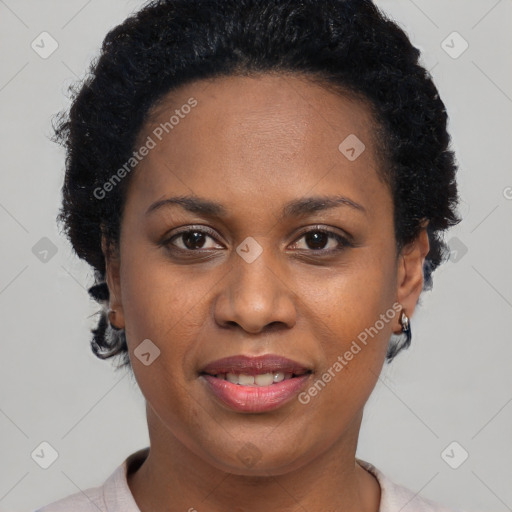 Joyful black young-adult female with short  black hair and brown eyes