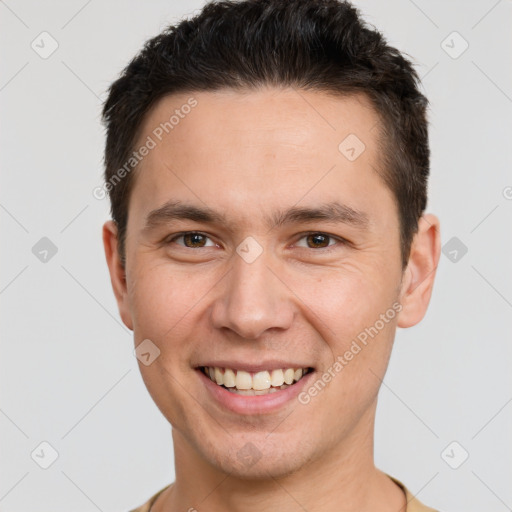 Joyful white young-adult male with short  brown hair and brown eyes