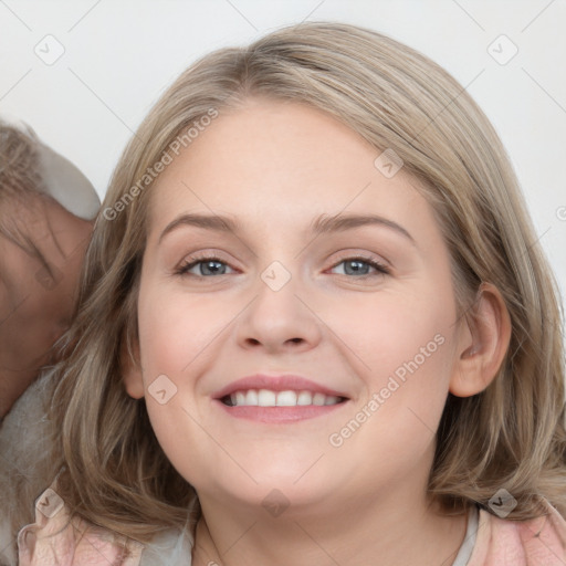 Joyful white young-adult female with medium  brown hair and blue eyes