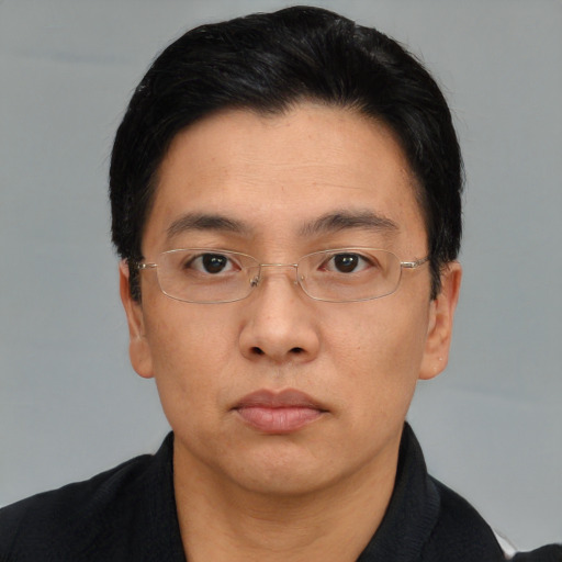 Neutral asian adult male with short  black hair and brown eyes