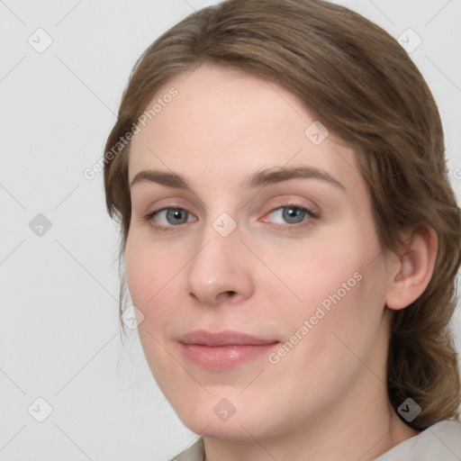 Joyful white young-adult female with medium  brown hair and green eyes