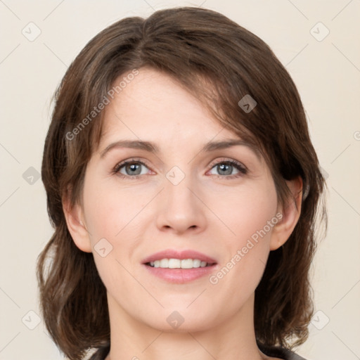 Joyful white young-adult female with medium  brown hair and green eyes