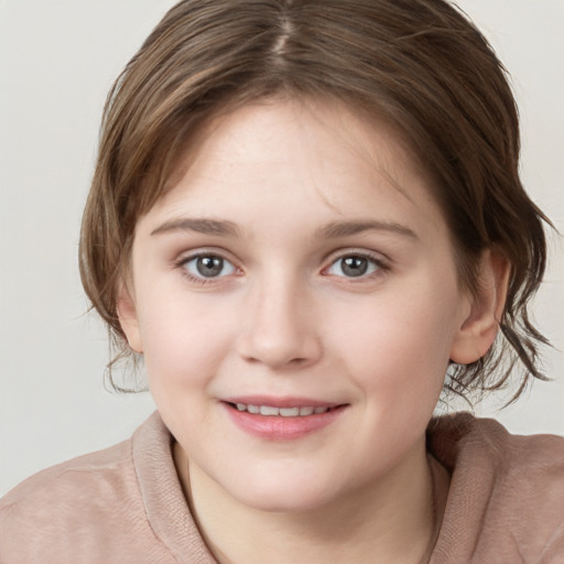 Joyful white child female with medium  brown hair and brown eyes