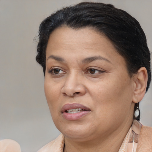 Joyful white adult female with short  brown hair and brown eyes