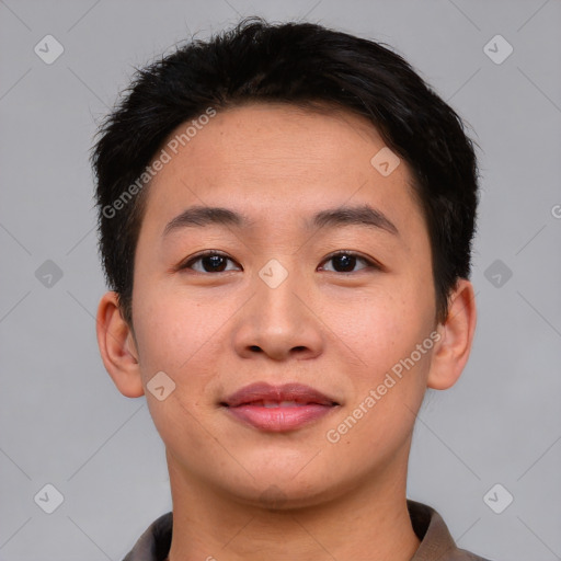 Joyful asian young-adult male with short  brown hair and brown eyes