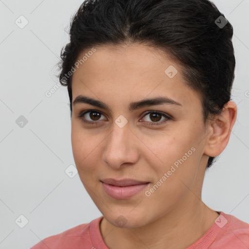 Joyful latino young-adult female with short  brown hair and brown eyes