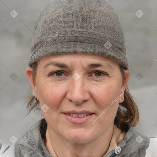 Joyful white adult female with medium  brown hair and blue eyes