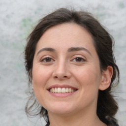 Joyful white adult female with medium  brown hair and brown eyes