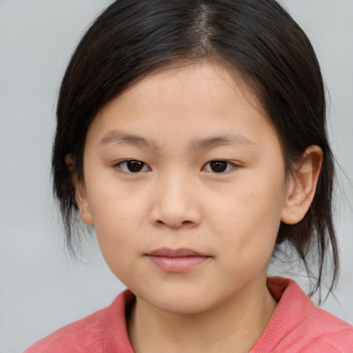 Joyful white child female with medium  brown hair and brown eyes