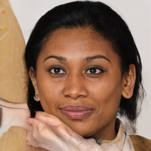 Joyful latino adult female with medium  black hair and brown eyes