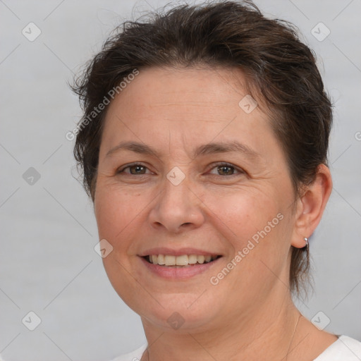 Joyful white adult female with short  brown hair and brown eyes