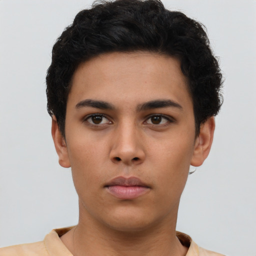 Neutral latino young-adult male with short  brown hair and brown eyes