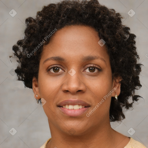 Joyful black young-adult female with short  brown hair and brown eyes