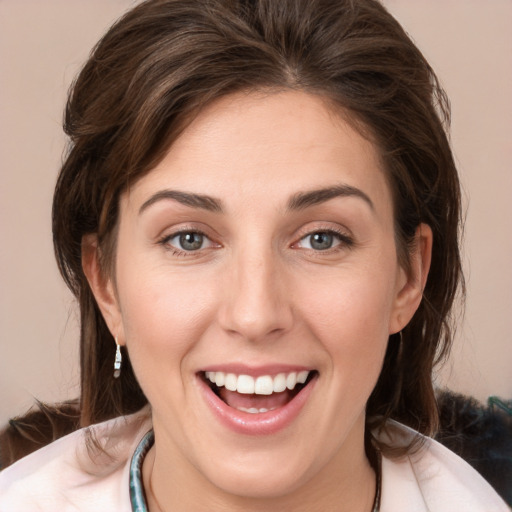 Joyful white young-adult female with medium  brown hair and brown eyes