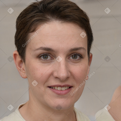 Joyful white young-adult female with short  brown hair and grey eyes