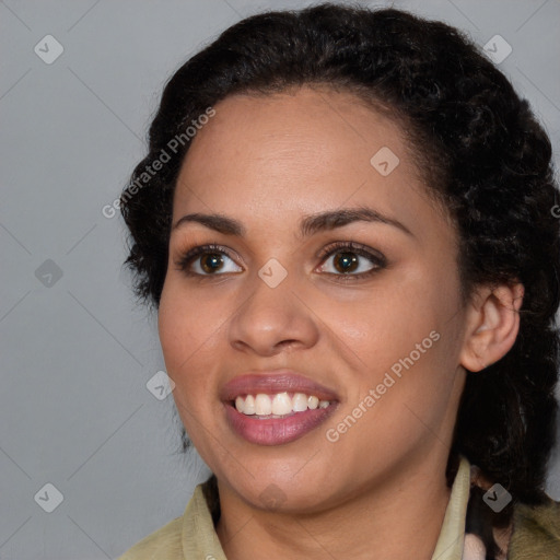 Joyful black young-adult female with medium  brown hair and brown eyes