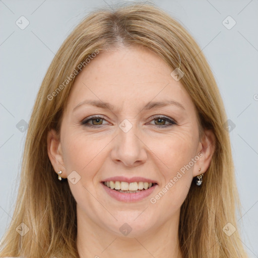 Joyful white adult female with long  brown hair and brown eyes