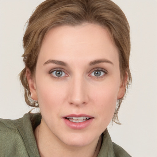 Joyful white young-adult female with medium  brown hair and blue eyes