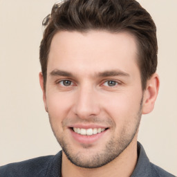 Joyful white young-adult male with short  brown hair and brown eyes